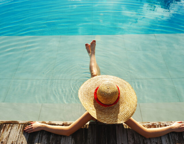 Woman relaxing by pool