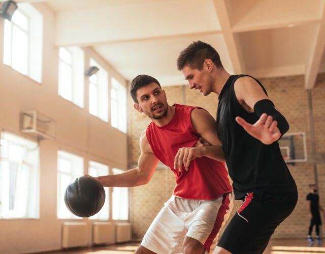 two guys playing basketball