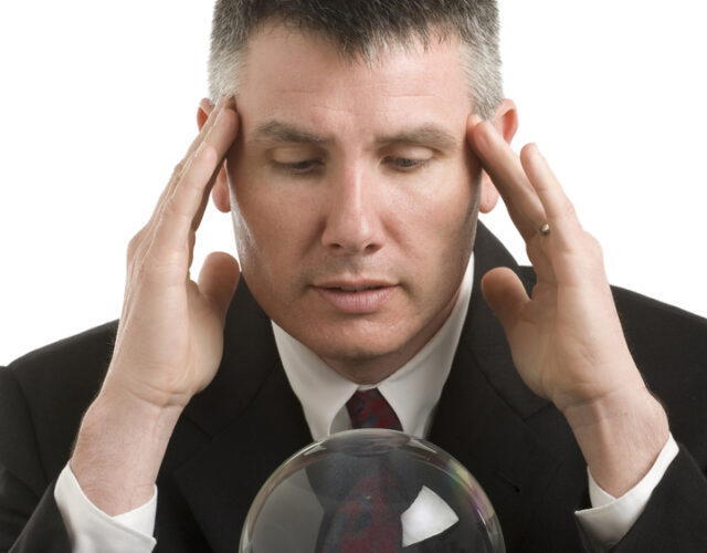 Man looking into crystal ball