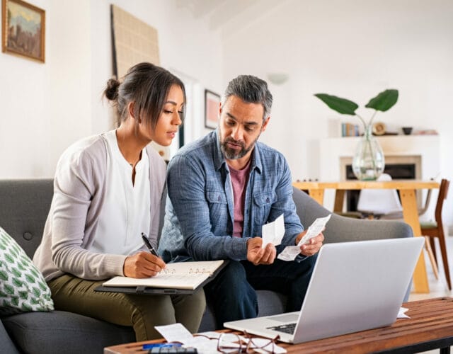 Mid adult couple working on home finance